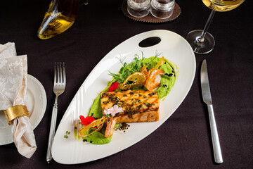 salmon steak with vegetables and sauce