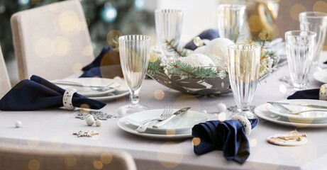 Stylish table setting for Christmas dinner in room