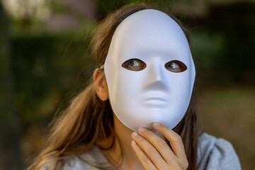 woman with full face white mask looking at her side
