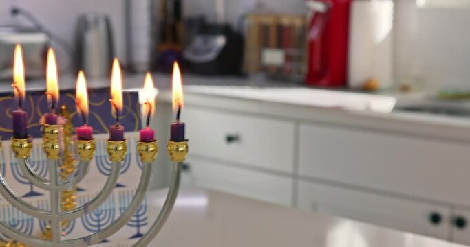 Hanukkah celebration Judaism tradition family religious holiday symbols lighting hanukkiah menorah candles