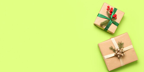 Obraz na płótnie Canvas Beautiful Christmas gifts on green background with space for text, top view