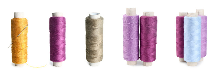 Set of bright thread spools on white background