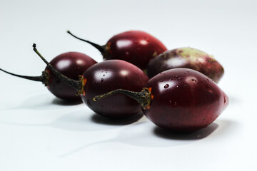 Tamarillo or Dutch Eggplant with the Latin name Solanum betaceum. Reddish orange in color with a characteristic aroma and sour taste.