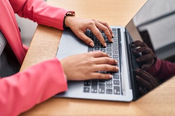 Young latin woman business worker using laptop at office