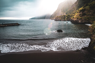 Magnisificat cloudy sunrise atmosphere on Seixal beach photographed in the morning. Seixal beach,...