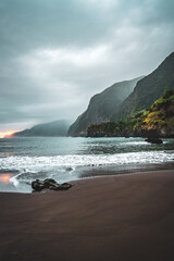 Magnisificat cloudy sunrise atmosphere on Seixal beach photographed in the morning. Seixal beach, Madeira Island, Portugal, Europe.