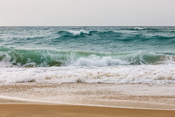 Fototapeta na wymiar View of beautiful sea with waves on cloudy day