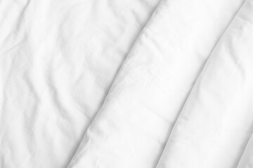 Closeup view of white folded bedding