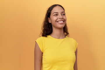 Young african american woman smiling confident standing over isolated yellow background