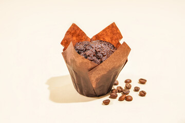 Tasty chocolate muffin on color background
