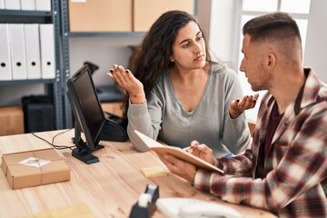 Fototapeta premium Man and woman ecommerce bussines workers stressed working at office