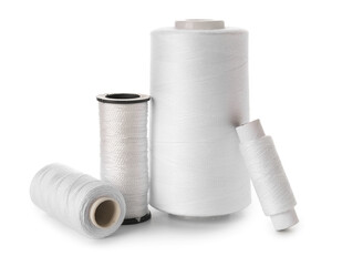 Different sewing thread spools isolated on white background