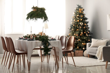 Interior of dining room with table and Christmas tree