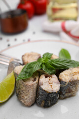 Fototapeta na wymiar Canned mackerel chunks served on white table, closeup