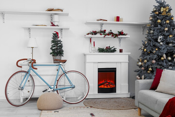 Obraz premium Interior of living room with bicycle, fireplace and Christmas trees