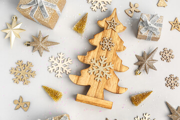Composition with beautiful Christmas decorations and gifts on grey background