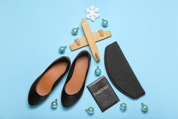 Christmas tree made of stewardess accessories and balls on blue background