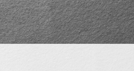 Two tone background of felt fabric texture background in black and white colors with copy space. 