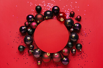 Composition with blank card and beautiful Christmas balls on color background