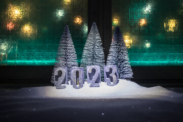 Happy New Year 2023. A frame of kitchen utensils, Christmas decorations, cinnamon, food and spruce...