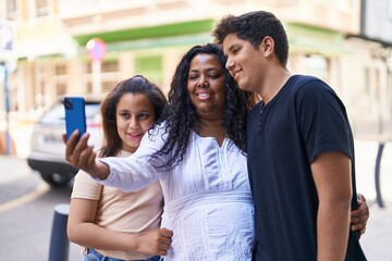 African american family make selfie by smartphone at street