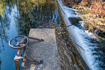 The wheel to the gate of the Lakin Dam on the McCloud River in California, USA