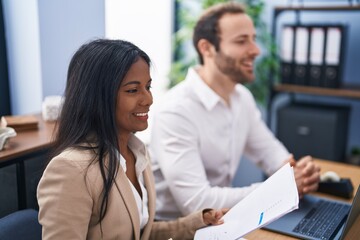 Man and woman business workers smiling confident working at office