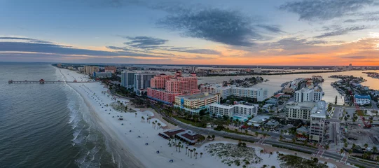 Papier Peint photo Clearwater Beach, Floride Row of hotels line Clearwater beach near Tampa with white sand colorful sunrise sky