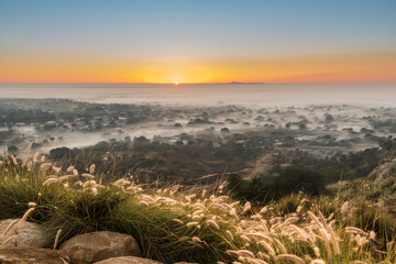 Sunrise and early morning fog in country town