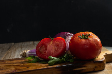 Obraz na płótnie Canvas tomatoes on a wooden background