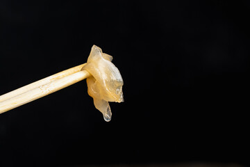 delivery of sushi roll at home with Chinese sticks and ginger