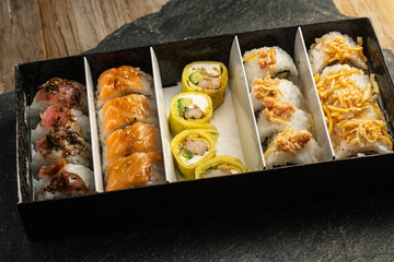 delivery of sushi roll at home with Chinese sticks and ginger