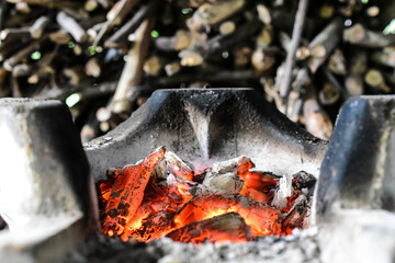 Close-up traditional red clay charcoal stove for preparing food to cook.