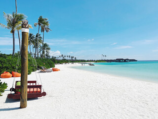 Beautiful landscape with sandy beach and palm trees. Travel to the Maldives. Nature background.
