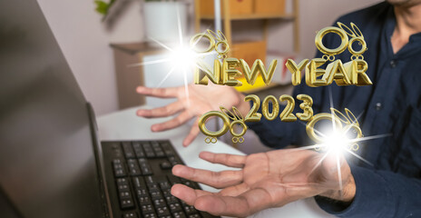Asian man hold UI interface web map app cloud online to laptop so finger touch online connect app 2023. 2023 new year number logo concept. Year of the rabbit  2023 new technology of people.