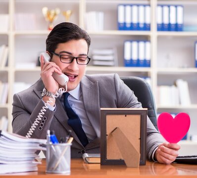 Businessman feeling love and loved in the office