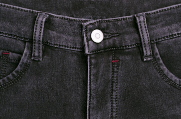 Part of dark jeans.
