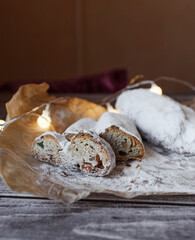 Fototapeta na wymiar Pie - stollen on the Christmas table. Stollen in the section. Rustic style