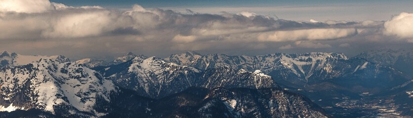Panoramic scene of Snowy Austria Mountains Alps with trees in Hallstatt, Austria
