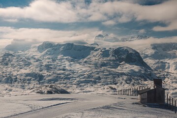 Landscape of Snowy Mountains Alps with cloudy sky in Hallstatt, Austria