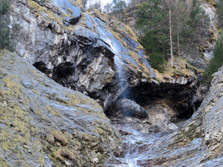 Waterfalls in the wild alpine canyon of Helltobel above in the Calfeisental valley and in the UNESCO World Heritage Tectonic Arena Sardona (UNESCO-Welterbe Tektonikarena Sardona), Vättis - Switzerland
