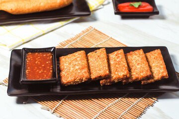 Indonesian fried tempeh with spicy chili sauce