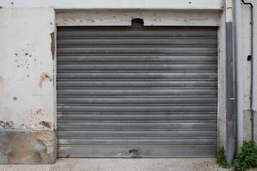 steel sequential old and worn metal garage door