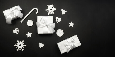 Fototapeta na wymiar Gift white box on a black background. Holiday concept.Christmas. New Year.