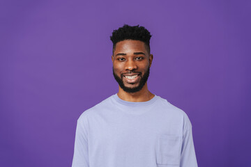 Fototapeta premium Happy bearded african american man smiling at camera
