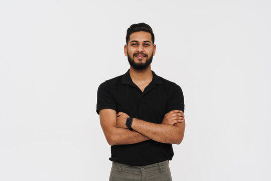 Portrait of middle aged indian man in black polo isolated