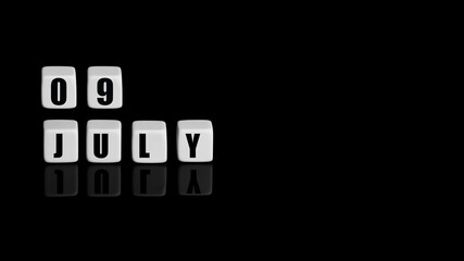 July 9th. Day 9 of month, Calendar date. White cubes with text on black background with reflection. Summer month, day of year concept