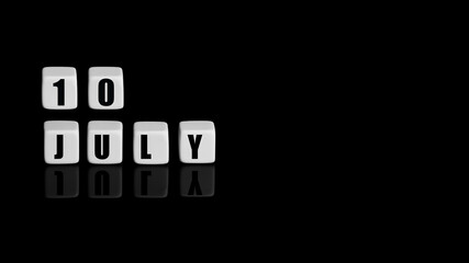 July 10th. Day 10 of month, Calendar date. White cubes with text on black background with reflection. Summer month, day of year concept
