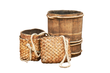 Retro bucket from planks and wicker old bag, isolated on a white background. Reconstruction of the events of the Middle Ages in Europe.