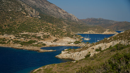 Southwestern tip of Turkey. Sunset from the ancient city of Datça Knidos. Yazikoy village harbor. Ancient Greek city of Knidos. The sky after sunset. Sunlight and shadows. Selective focus close-up.